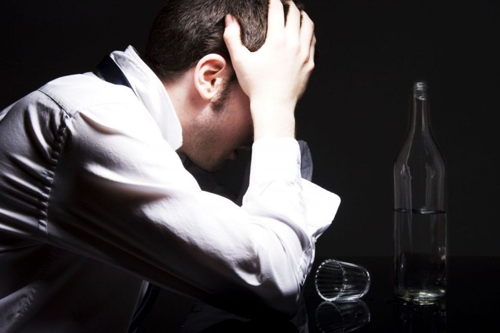 Alcohol dependence (alcoholism). Alcohol addiction. A man with a drinking problem.